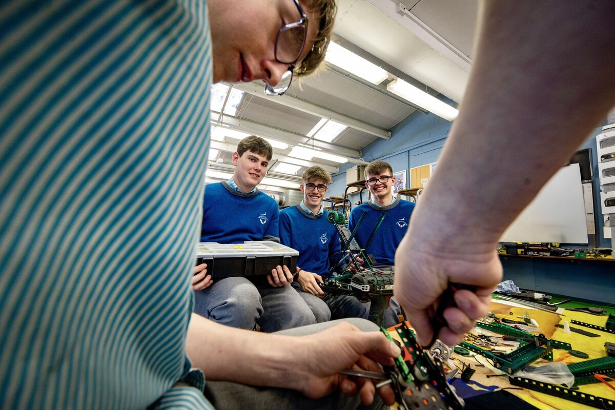 Collectively known as Nuts and Bolts, the team enjoys a tinkering session as they make the finishing touches to their beloved machine. Picture: Chani Anderson