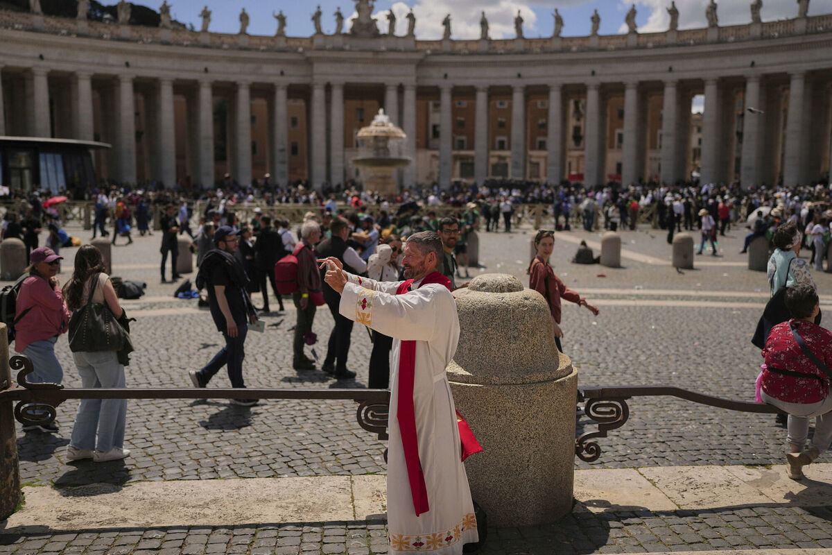 A missionary man from Belize records a video after the funeral of Pope Francis in St. Peter's Square at the Vatican, Saturday, April 26, 2025. (AP Photo/Andreea Alexandru)