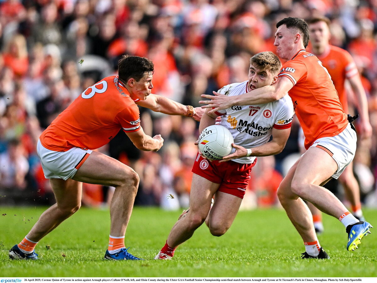 VINTAGE TUSSLE: Cormac Quinn of Tyrone in action against Armagh players Callum O'Neill, left, and Oisin Conaty during the Ulster GAA Football Senior Championship semi-final match between Armagh and Tyrone at St Tiernach's Park in Clones, Monaghan. Photo by Seb Daly/Sportsfile