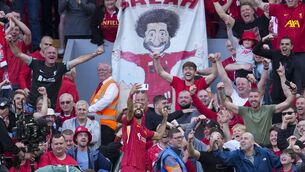<p>CHAMPIONS: Liverpool's Mohamed Salah takes a selfie with a fans. Pic: AP Photo/Jon Super.</p>