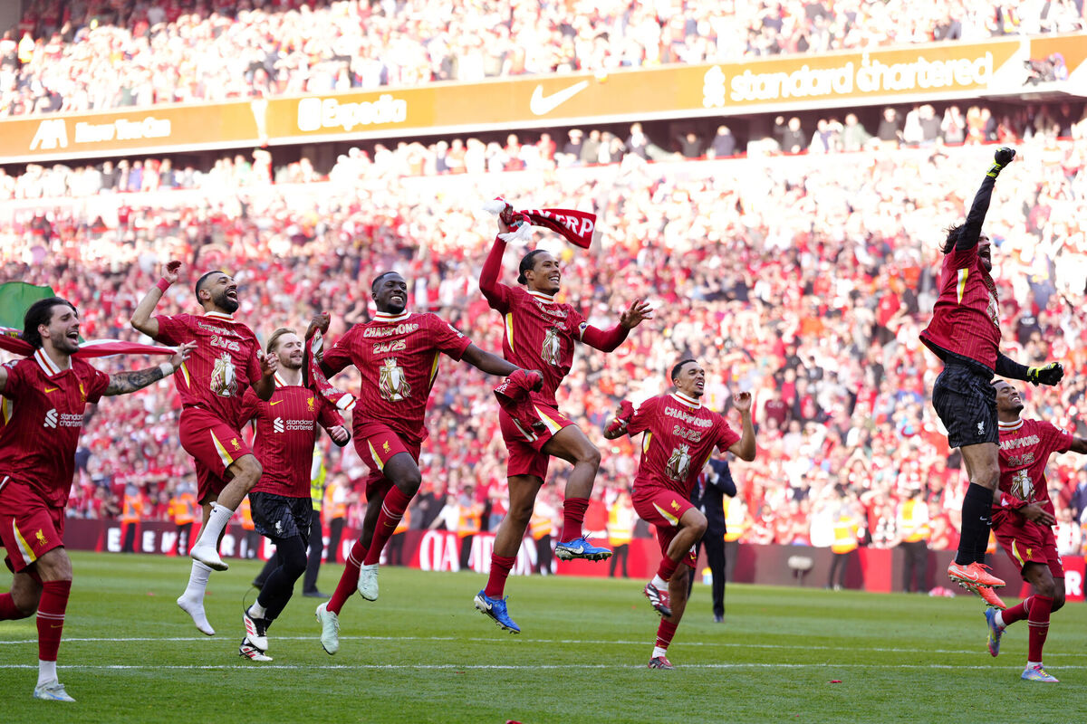 Liverpool players celebrate victory and the Premier League title. Pic: Peter Byrne/PA Wire. Liverpool players celebrate victory and the Premier League title. Pic: Peter Byrne/PA Wire.