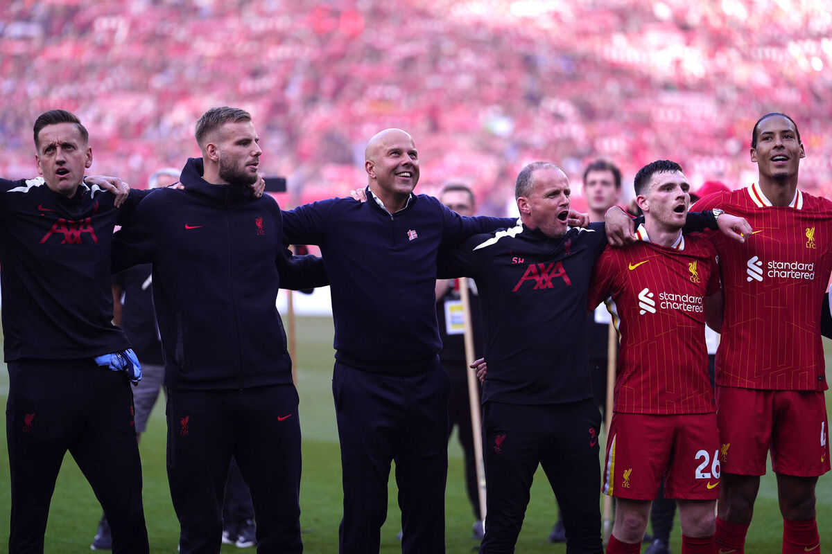 Liverpool manager Arne Slot (centre) celebrate victory and the Premier League title with players and staff. Pic: Peter Byrne/PA Wire. Liverpool manager Arne Slot (centre) celebrate victory and the Premier League title with players and staff. Pic: Peter Byrne/PA Wire.