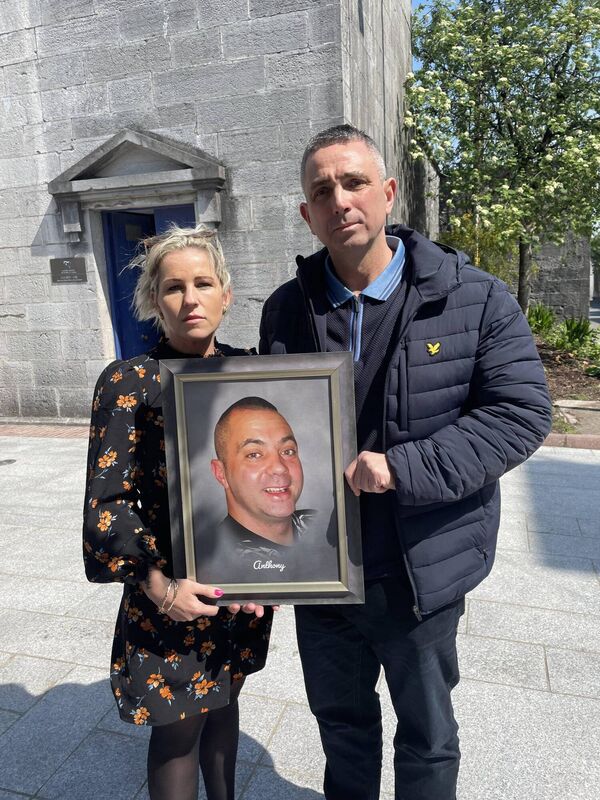 The late Anthony Hennessy's wife, Melissa and his brother, Kenneth, hold a framed photograph of him following the inquest into his death. The late Anthony Hennessy's wife, Melissa and his brother, Kenneth, hold a framed photograph of him following the inquest into his death.