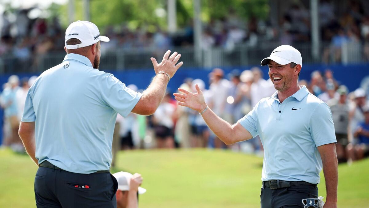 Rory McIlroy is congratulated by Shane Lowry after his eagle on the 18th green on day three of the Zurich Classic of New Orleans. Pic: Chris Graythen/Getty Images.