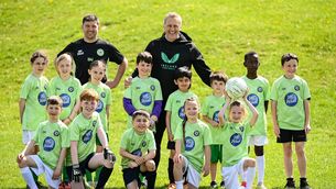 <p>NEW RECRUITS: Republic of Ireland head coach Heimir Hallgrimsson and coach Fionn Prendergast with players during a visit to Knocklyon United MiWadi Football Camp in Dublin. Pic: Stephen McCarthy/Sportsfile.</p>