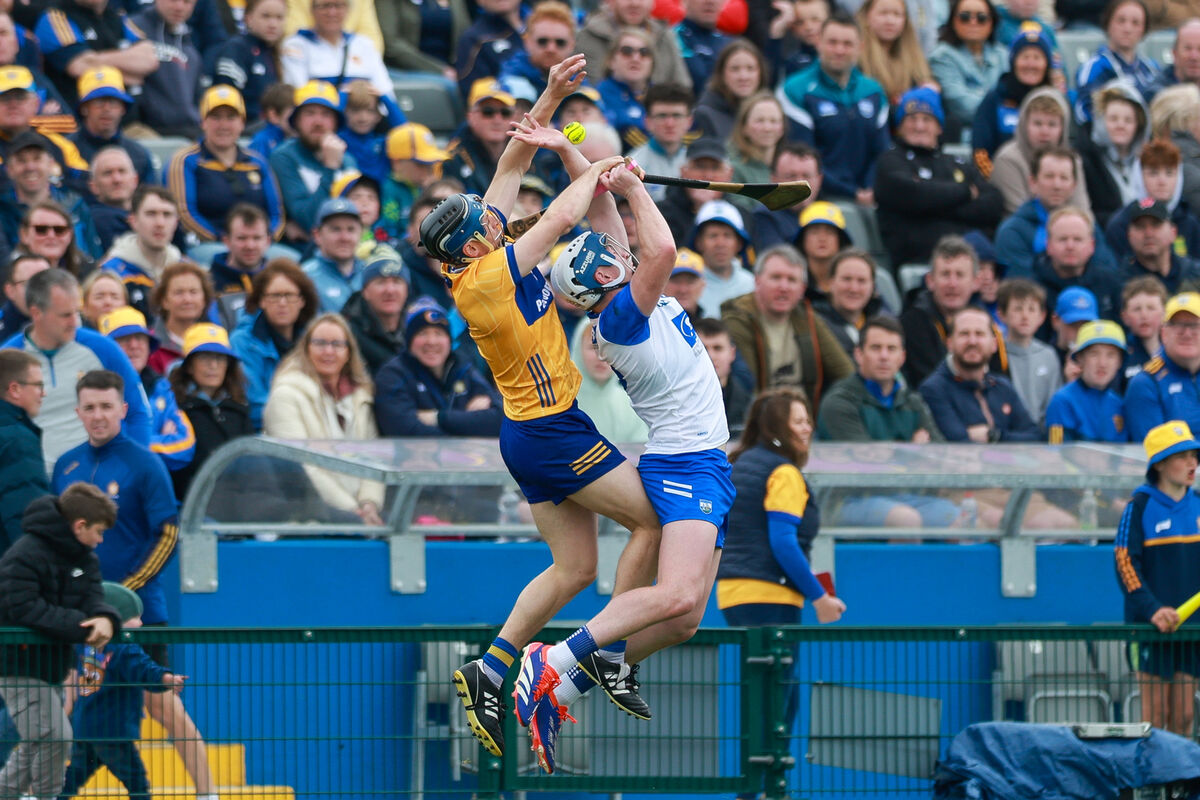David McInerney of Clare and Stephen Bennett of Waterford jump for the ball. Pic: Natasha Barton/Inpho