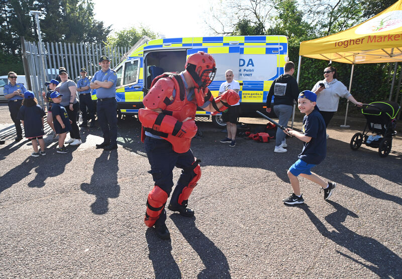 Reece (right) learns about crowd control and the work of the public order unit at the training programme at Togher Garda Station. Picture: Larry Cummins Reece (right) learns about crowd control and the work of the public order unit at the training programme at Togher Garda Station. Picture: Larry Cummins