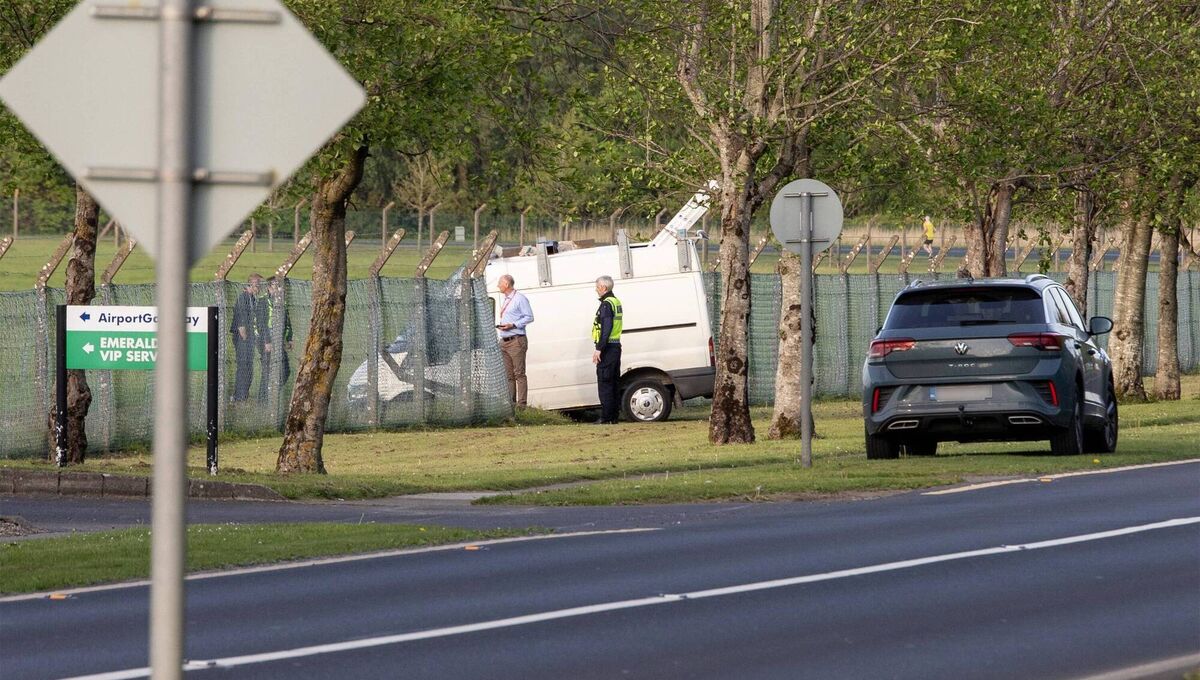 A number of people wearing orange jump suits, hard hats, and scarves over their faces  entered Shannon Airport’s 'airside' area. They ran in the direction of a taxiway, before they were quickly apprehended. Picture: Press 22