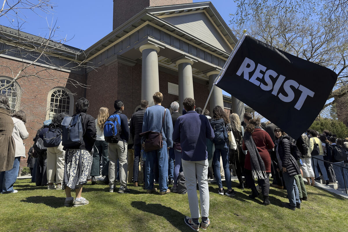 Students, faculty and members of the Harvard University community rally last month. On Friday, Trump threatened to revoke Harvard University's tax free status, the latest escalation in a war with the world famous Ivy League school over federal funding. File photo: AP