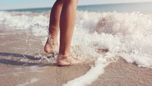 <p>Jumping in the sea waves concept for summer beach vacation</p>
