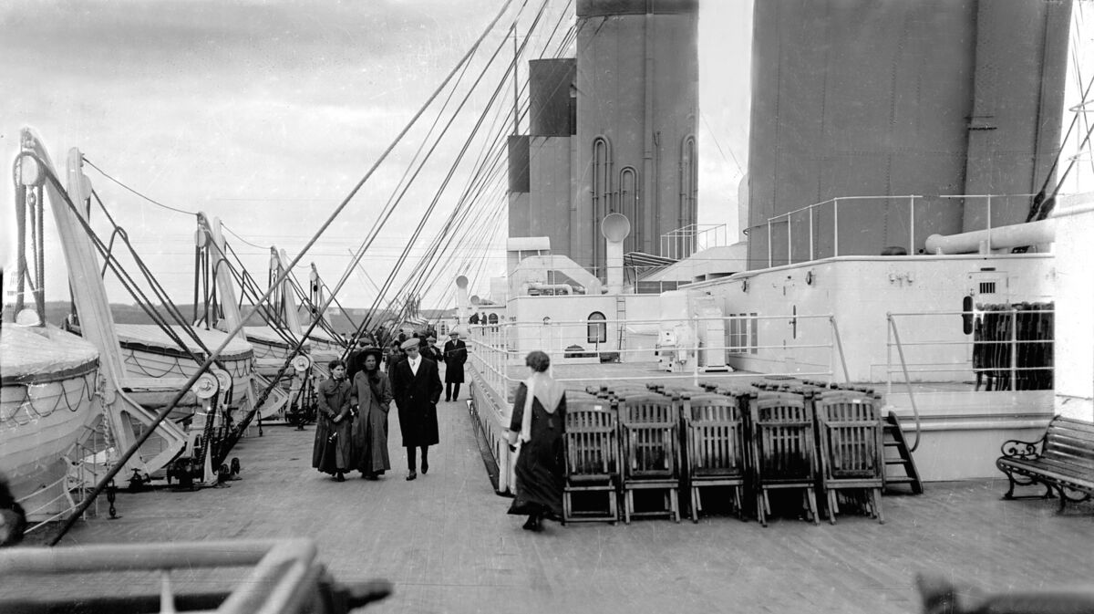 On April 11, 1912, the Titanic called to the port of Queenstown (now Cobh), Co. Cork on her maiden voyage to New York. The picture shows some of the passengers strolling on the top deck as the liner was anchored just outside the mouth of Cork Harbour. A few days later, she sank after hitting an iceberg and most of those on board were killed. It’s not known if those in the picture survived or not. Ref 114/115. Picture: Thomas Barker, Cork Examiner photographer On April 11, 1912, the Titanic called to the port of Queenstown (now Cobh), Co. Cork on her maiden voyage to New York. The picture shows some of the passengers strolling on the top deck as the liner was anchored just outside the mouth of Cork Harbour. A few days later, she sank after hitting an iceberg and most of those on board were killed. It’s not known if those in the picture survived or not. Ref 114/115. Picture: Thomas Barker, Cork Examiner photographer