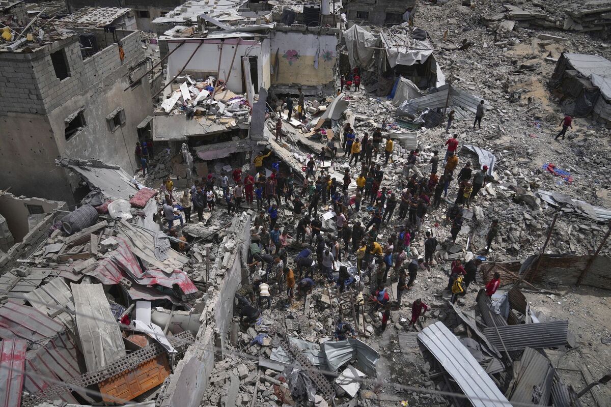 Palestinians search the rubble of a house targeted by an Israeli army strike that killed at least five people in Khan Younis on Thursday, May 1. Picture: Abdel Kareem Hana/AP