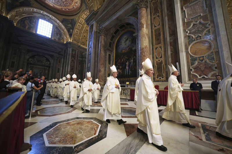 Cardinals arrive in St. Peter's Basilica to attend a mass on the seventh of nine days of mourning for late Pope Francis, at the Vatican, Saturday, May 3, 2025. (AP Photo/Alessandra Tarantino)