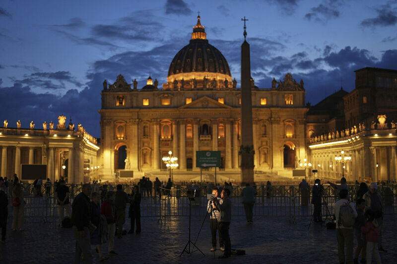 Journalists work next to St. Peter's Square, at the Vatican, on Monday, May 5, 2025, ahead of the upcoming conclave starting on May 7, to elect the 267th Roman pontiff. (AP Photo/Francisco Seco)
