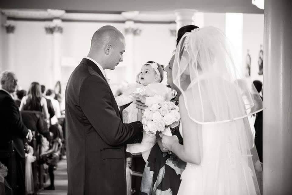 Orla McAndrew and her husband Steve with their daughter on their wedding day in 2013.
