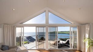 <p>Whistler has a top setting on the Coast Road by Fountainstown beach. Agent Roy Dennehy guides the upside down home at €1.3 million for Bunny's and The Lodge bar owners the O'Brien family</p>