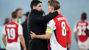 <p>END OF THE ROAD: Arsenal manager Mikel Arteta with Martin Odegaard after the final whistle in Paris. </p>