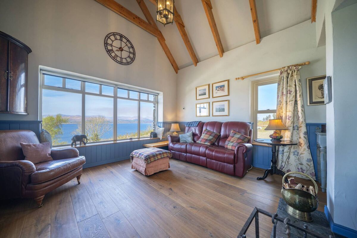 Barn-height ceiling in living area with seaward views Barn-height ceiling in living area with seaward views