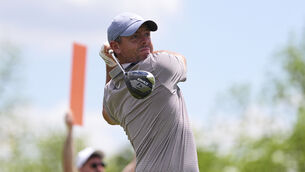 <p>Rory McIlroy hits on the fourth hole during the first round of the Truist Championship (Matt Rourke/AP)</p>