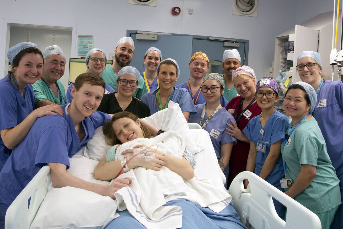 Grace and Angus Davidson (front) with the hospital team at the birth of baby Amy Isabel.Picture: Womb Transplant UK/PA Wire Grace and Angus Davidson (front) with the hospital team at the birth of baby Amy Isabel.Picture: Womb Transplant UK/PA Wire
