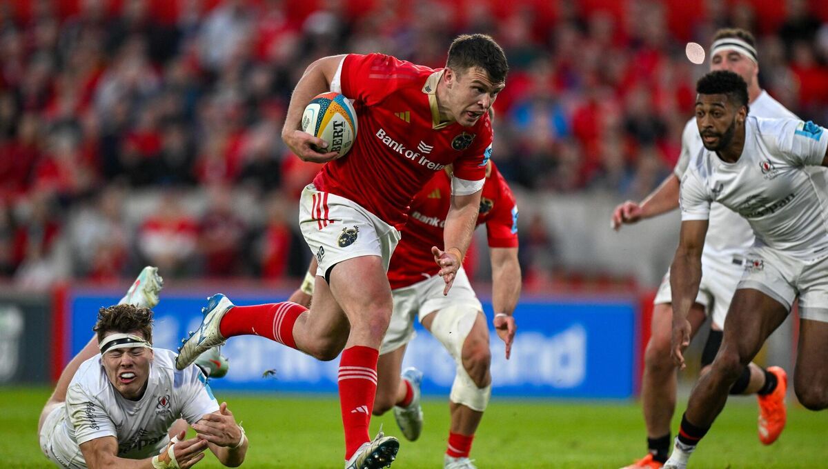 AT THE DOUBLE: Tom Farrell of Munster beats the tackle of Jude Postlethwaite of Ulster on the way to scoring his side's fifth try. Pic: Brendan Moran/Sportsfile