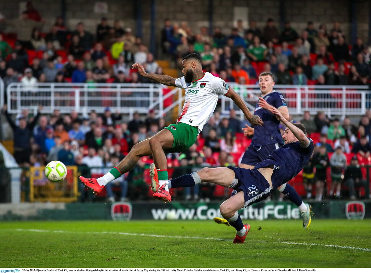 Djenairo Daniels of Cork City scores his side's first goal despite the attention of Kevin Holt of Derry City. Pic: Michael P Ryan/Sportsfile
