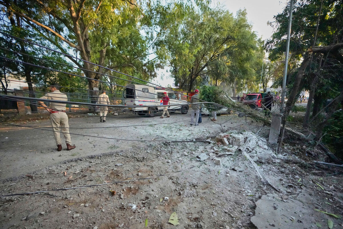 Security personnel secure the area after a Pakistan's drone attack on a residential building in Jammu, India, Saturday, May 10, 2025. (AP Photo/Channi Anand)