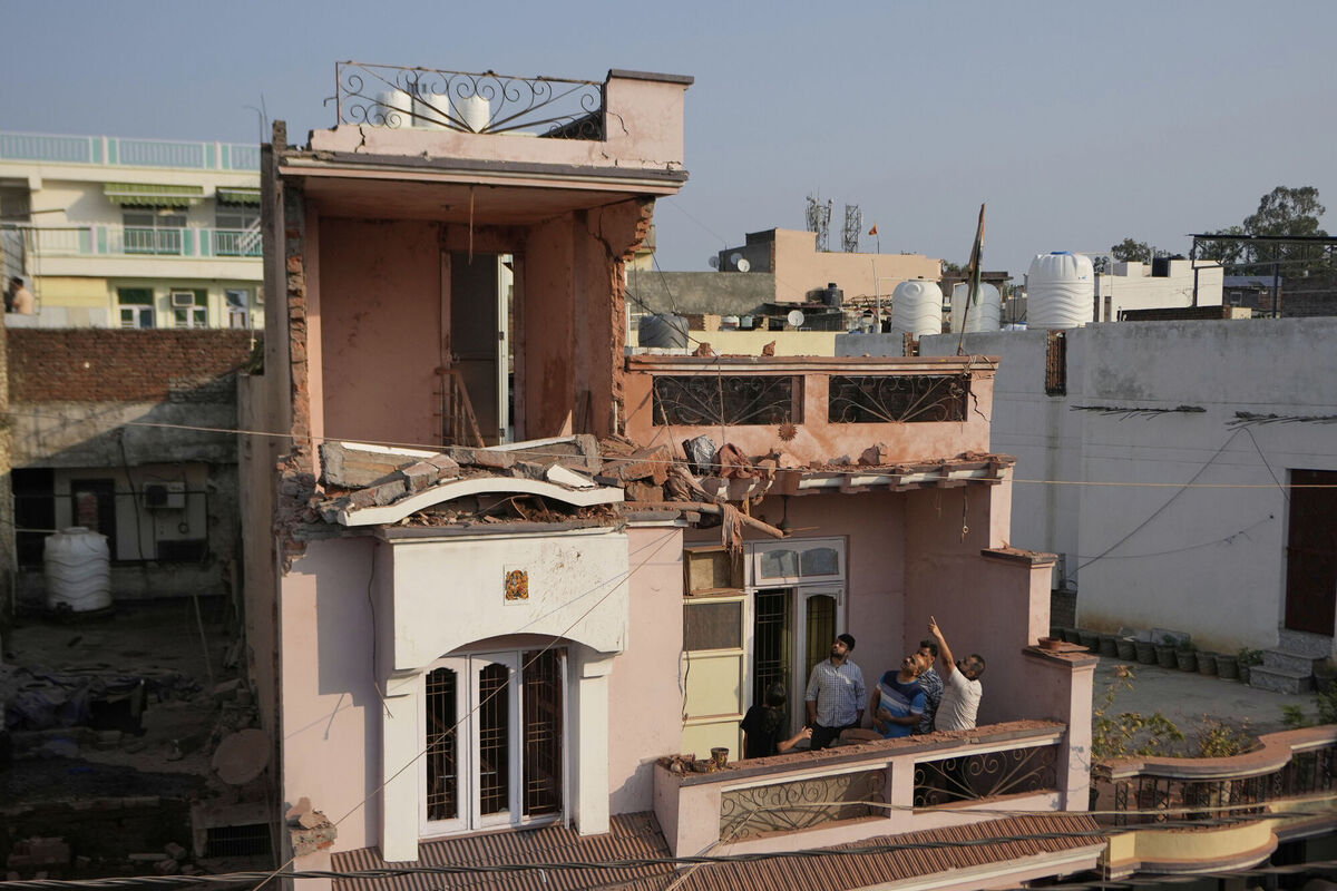 A resident shows the damage by a Pakistan's drone attack in Jammu, India, Saturday, May 10, 2025. (AP Photo/Channi Anand)