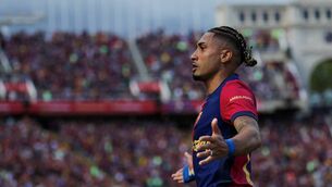 <p>Barcelona's Brazilian forward #11 Raphinha celebrates scoring their fourth goal during the Spanish league football match between FC Barcelona and Real Madrid CF at Estadi Olimpic Lluis Companys in Barcelona, on May 11, 2025. (Photo by LLUIS GENE / AFP) (Photo by LLUIS GENE/AFP via Getty Images) </p>