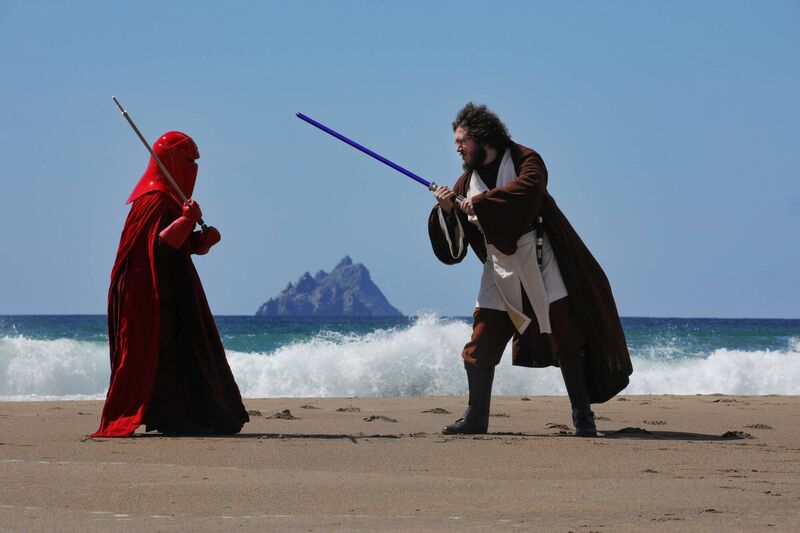 Andrea Paolucci and Giorgia Gallerani square off in Star Wars costumes at St Finian's Bay, Ballinskelligs, Co Kerry, with Skellig Michael and Skellig Beag in the distance. While access to the island itself is carefully limited, many tourists come just to see the island from villages and beaches along the coast. Picture: Valerie O'Sullivan