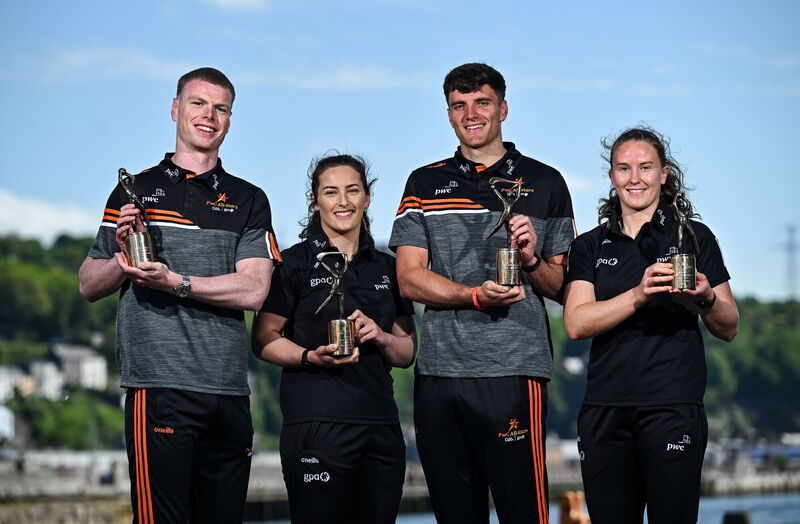 PwC GAA/GPA Player of the Month for April Cork hurler Brian Hayes, Meath footballer Mathew Costello, left, and PwC GPA Women Players of the Month for April, Kerry ladies footballer Síofra OShea, right, and Offaly camogie player Mairéad Teehan with their awards at PwC offices in Cork today. Photo by David Fitzgerald/Sportsfile