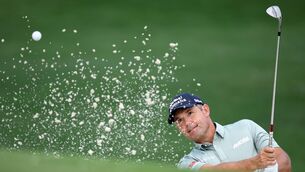 <p>GREAT FORM: Padraig Harrington of Ireland plays a shot from a bunker on the first hole prior to the PGA Championship at Quail Hollow Country Club. Pic: Jared C. Tilton/Getty Images.</p>
