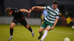 <p>Josh Honohan of Shamrock Rovers in action against Owen Lambe of Drogheda United. Pic: David Fitzgerald/Sportsfile</p>