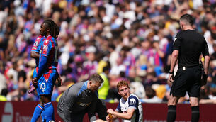 <p>Dejan Kulusevski receives treatment during Tottenham’s 2-0 loss at home to Crystal Palace (John Walton/PA)</p>
