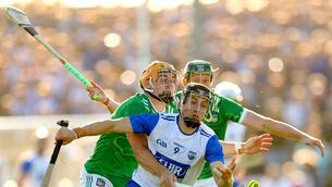 <p>Limerick’s Adam English and William O'Donoghue tackle Jamie Barron of Waterford. Pic: James Crombie, Inphp</p>