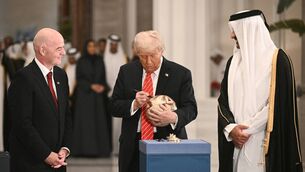 <p>Gianni Infantino with Donald Trump and Qatar’s Emir Sheikh Tamim bin Hamad Al Thani in Doha this week. Pic: BRENDAN SMIALOWSKI/AFP via Getty Images</p>