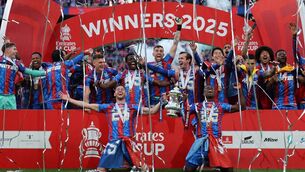 <p>GLAD ALL OVER: Crystal Palace's Marc Guehi and Joel Ward lift the FA Cup. Pic:  ADRIAN DENNIS/AFP via Getty Images</p>