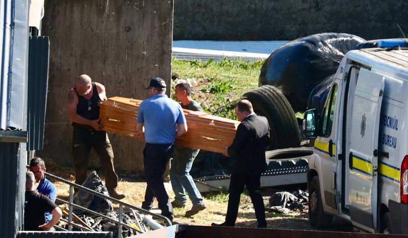 Friends and gardaí bring Michael Gaine's coffin into his cattle shed at his farm. Picture: Neil Michael Friends and gardaí bring Michael Gaine's coffin into his cattle shed at his farm. Picture: Neil Michael