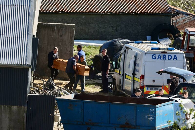 A coffin containing remains is carried out of the cattle shed at the farm of Michael Gaine in Kerry. Picture Neil Michael A coffin containing remains is carried out of the cattle shed at the farm of Michael Gaine in Kerry. Picture Neil Michael