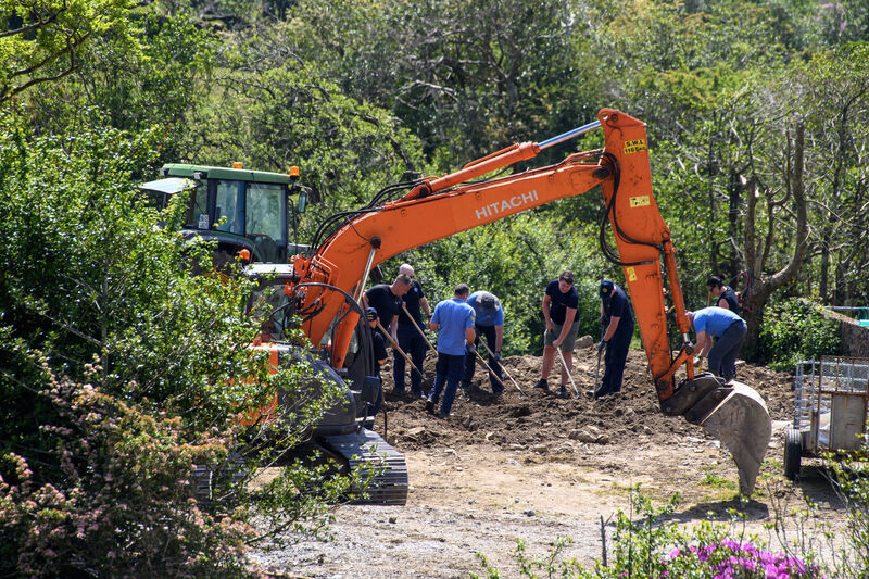  Garda members digging near the cattle sheds on the farm of Michael Gaine at Carrig East, Kenmare, Co Kerry. Picture: Dan Linehan