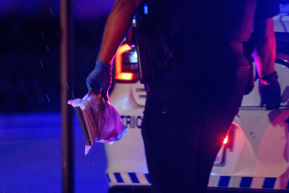 A Washington DC Metro police office carries an evidence bag to his car. Picture: AP Photo/Rod Lamkey, Jr A Washington DC Metro police office carries an evidence bag to his car. Picture: AP Photo/Rod Lamkey, Jr