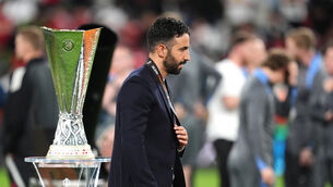 <p>SO CLOSE, YET...: Manchester United manager Ruben Amorim walks past the Europa League trophy. Pic: Adam Davy/PA</p>