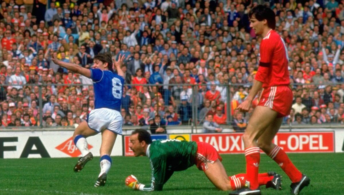Gary Lineker, of Everton, beats Liverpool’s Bruce Grobbelaar and Alan Hansen to score during the FA Cup final at Wembley Stadium in 1986. Liverpool won the match 3-1. Picture: David Cannon /Allsport Gary Lineker, of Everton, beats Liverpool’s Bruce Grobbelaar and Alan Hansen to score during the FA Cup final at Wembley Stadium in 1986. Liverpool won the match 3-1. Picture: David Cannon /Allsport