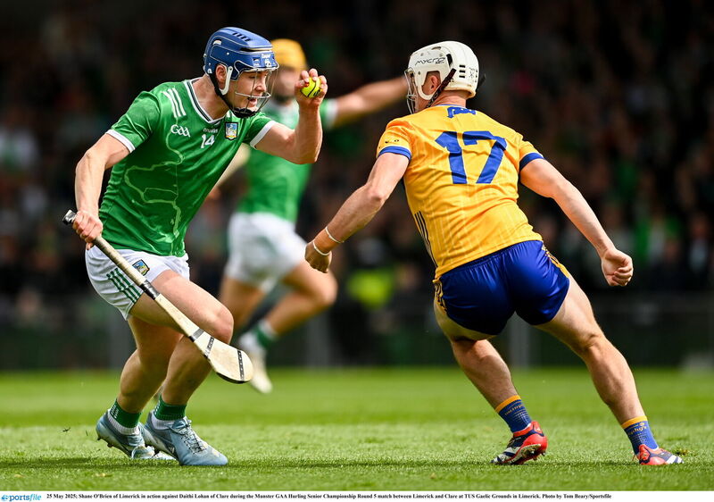Shane O'Brien of Limerick in action against Daithi Lohan of Clare. Pic: Tom Beary/Sportsfile