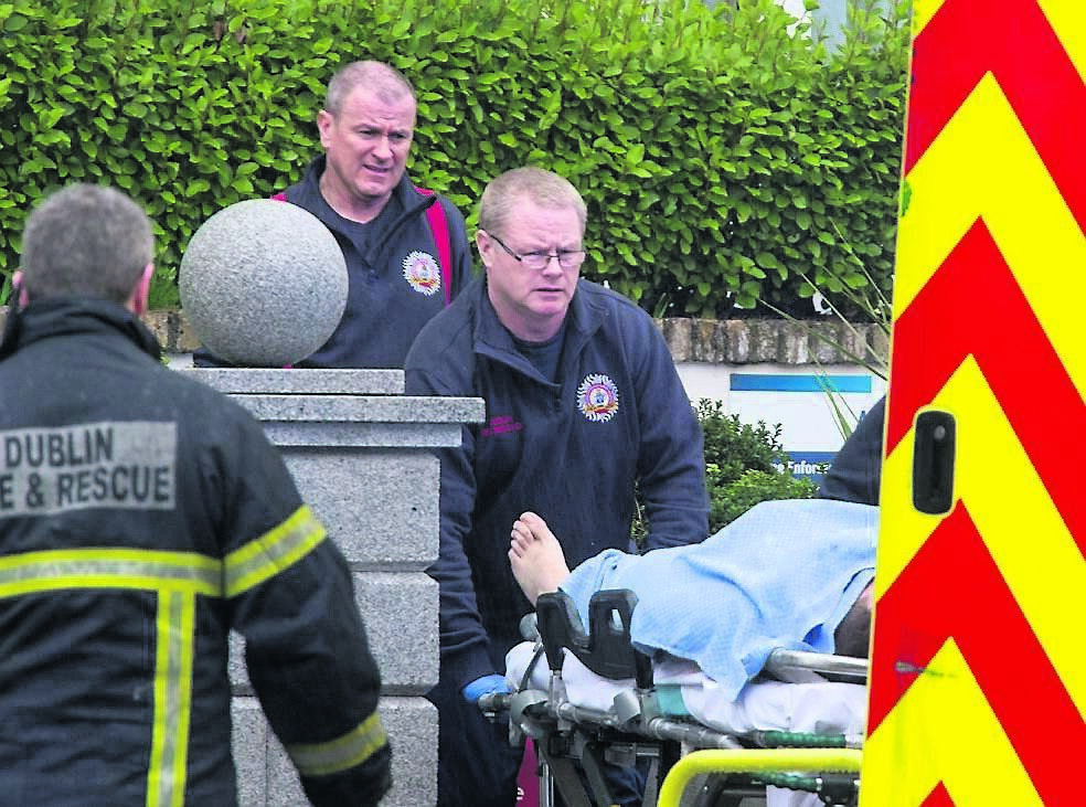 The scene after the shootings at the Regency Hotel on Friday afternoon as paramedics remove a man injured in the attack. Picture: Cascadenews.co.uk