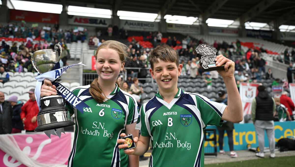 H5 FINAL: Aghabullogue 's Elise O'Donoghue and William Galvin with their trophies after their win in the H5 Allianz Sciath na Scol Chorcaí finall at Supervalu Páirc Uí Chaoimh. Pic: Dan Linehan