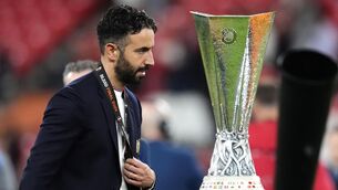 <p>CHOKE: Manchester United's Ruben Amorim walks past the Europa League trophy after their defeat to Spurs. Pic: Nick Potts/PA Wire.</p>