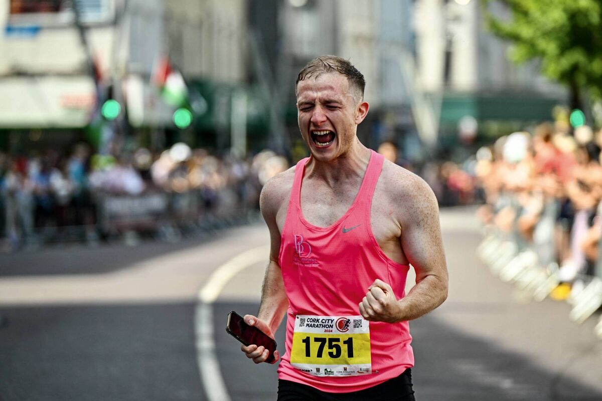 Aaron Horan struggles to contain his emotions as he crosses the finish line of the 2024 Cork City Marathon. Picture: Chani Anderson 