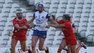 <p>Cork’s Izzy O’Regan and Laura Hayes tackle Mairead O’Brien of Waterford in their Very National League Division 1A clash. Pic: Lorraine O’Sullivan, Inpho</p>