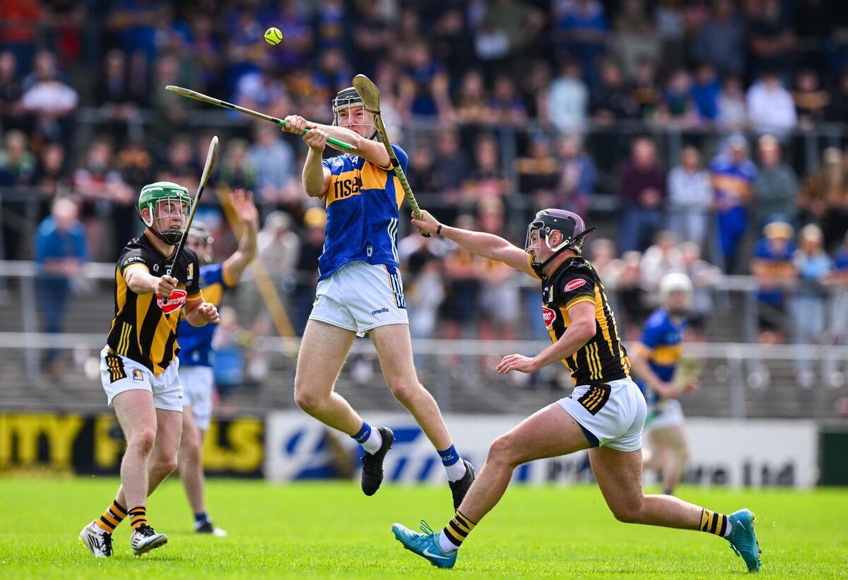 Paddy McCormack of Tipperary is tackled by Timmy Kelly, left, and Eoghan Lyng. Picture: Ray McManus/Sportsfile